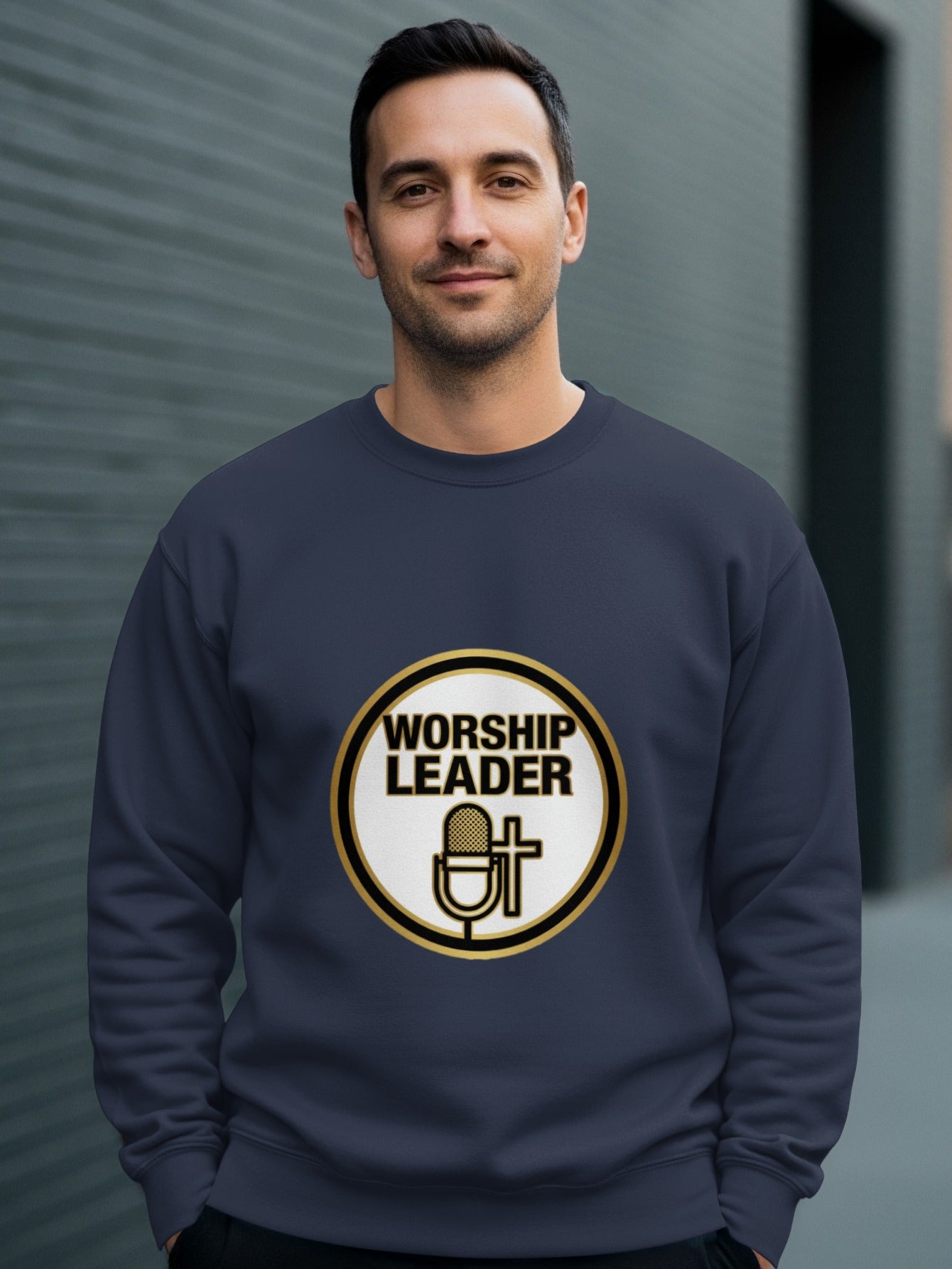 Man wearing a navy sweatshirt with a "Worship Leader" logo featuring a microphone and cross.