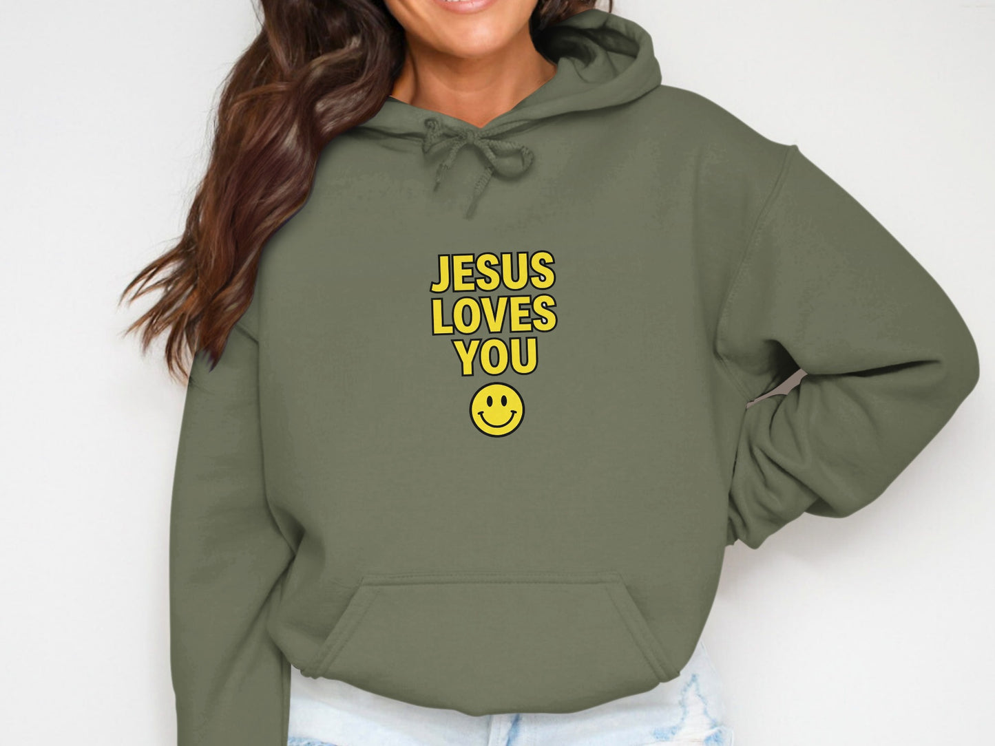Green hoodie with "Jesus Loves You" text and smiley face graphic.