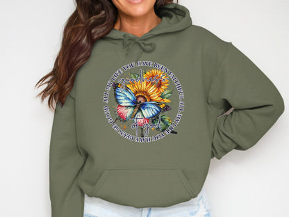 Hoodie with sunflower, butterfly, and "Goodness of God" text.