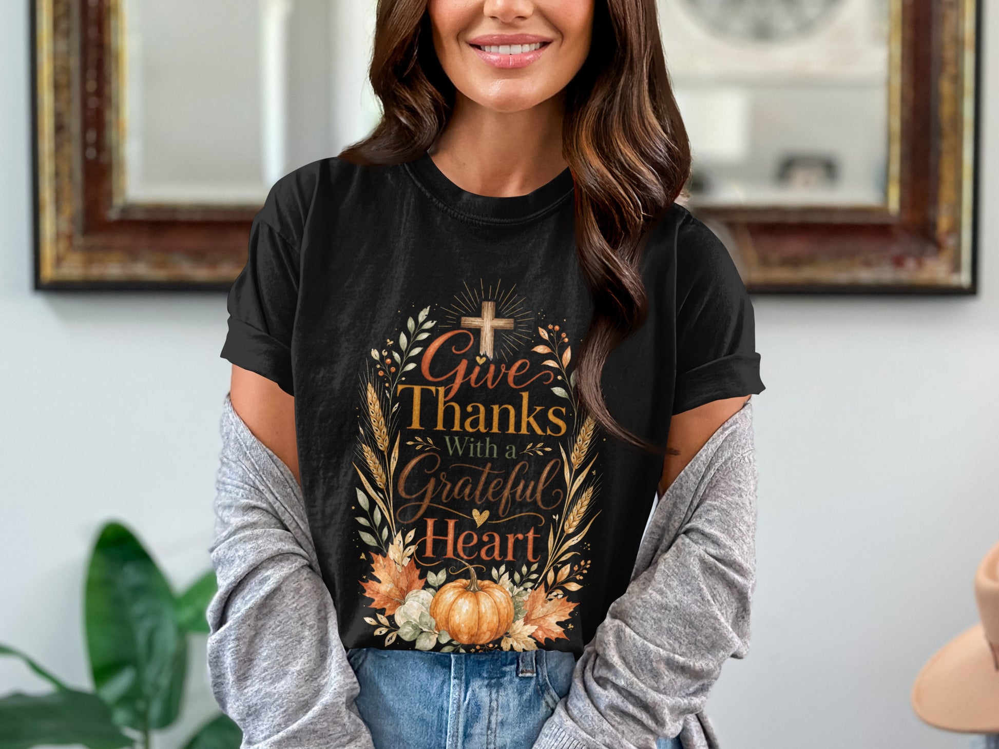 Black t-shirt with text "Give Thanks With a Grateful Heart" design.
