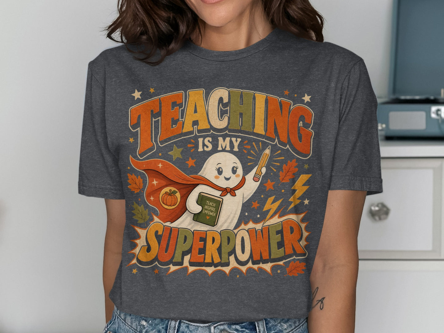 Ghost wearing a cape holding a book and pencil, "Teaching is my superpower" text.