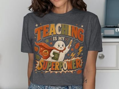 Ghost wearing a cape holding a book and pencil, "Teaching is my superpower" text.
