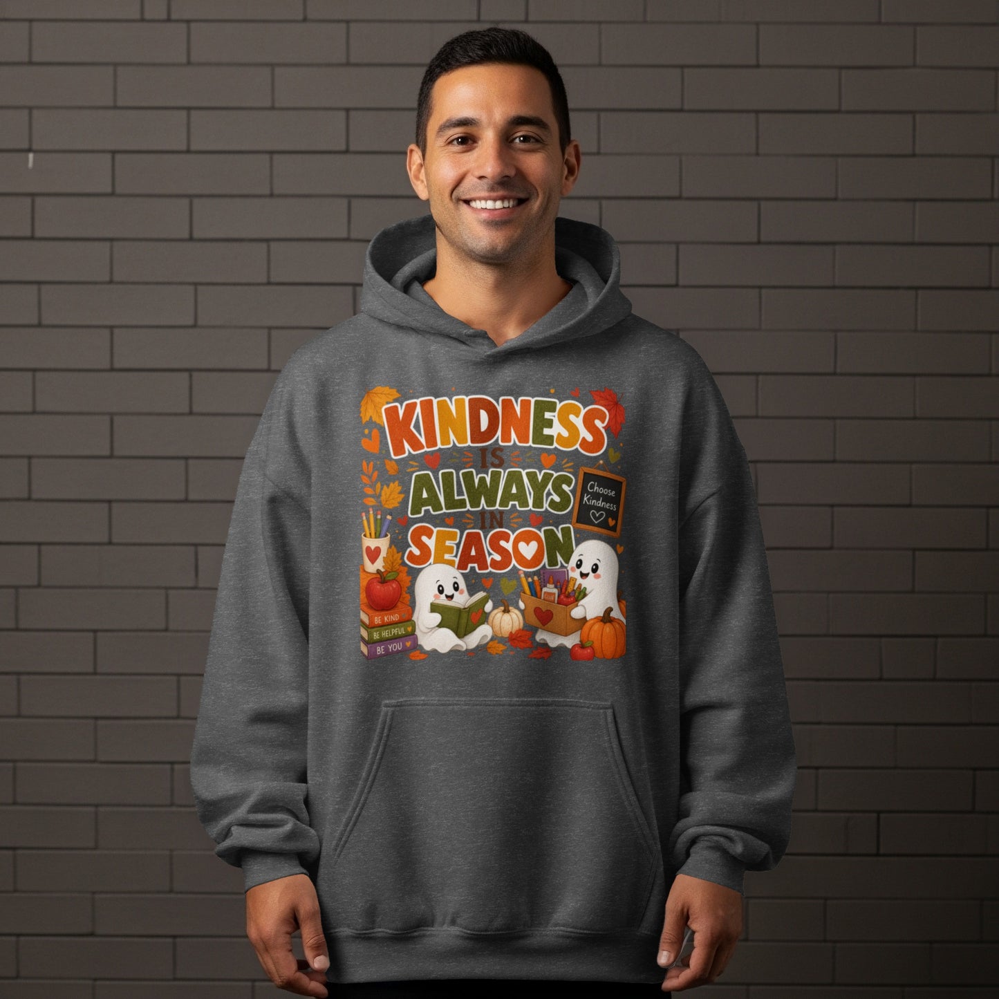 "Kindness Is Always In Season" text with ghosts and fall imagery on a gray hoodie.