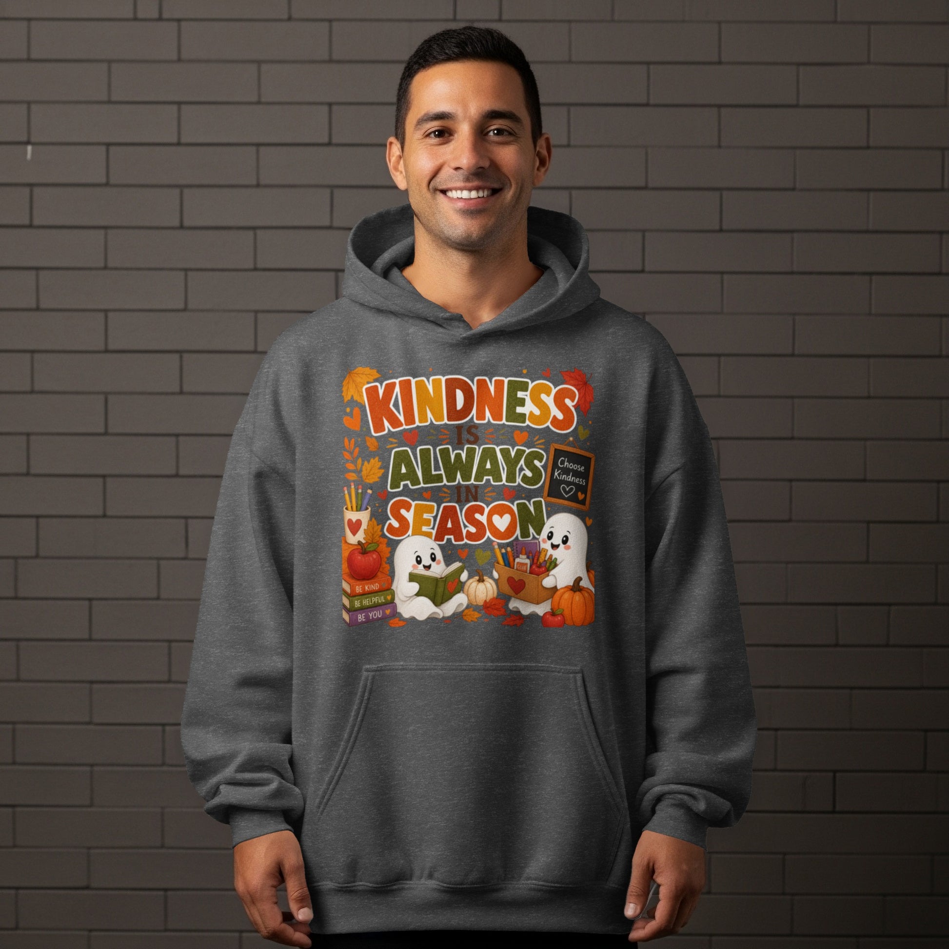 "Kindness Is Always In Season" text with ghosts and fall imagery on a gray hoodie.