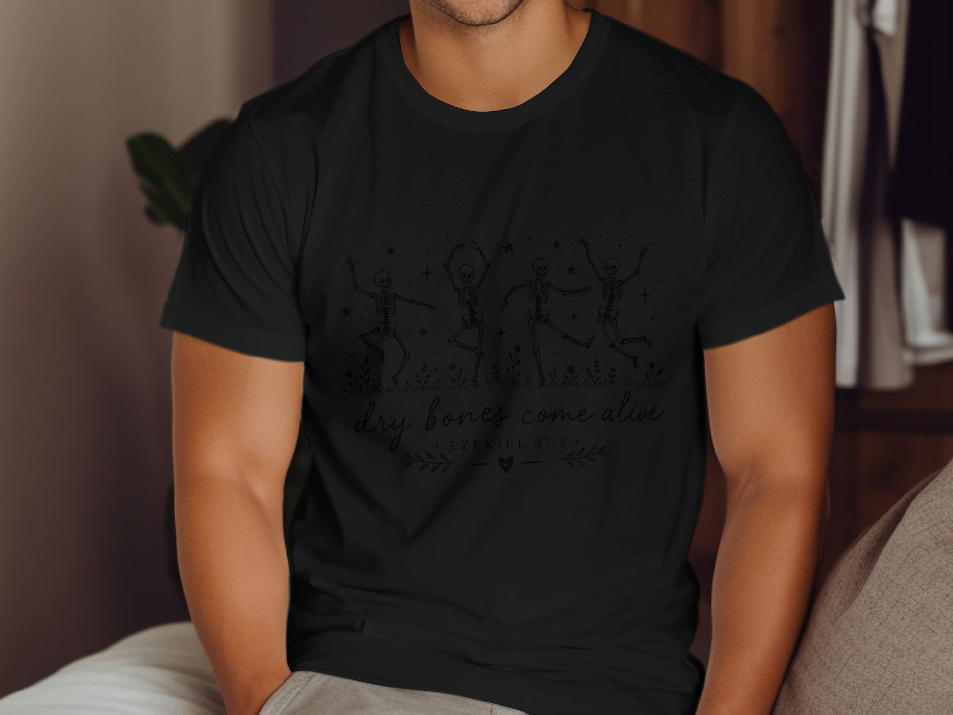 Black t-shirt with dancing skeleton design and "dry bones come alive" text.