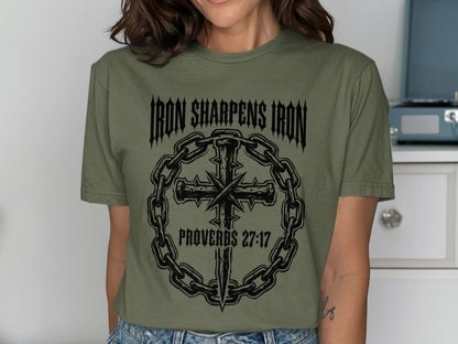 Green t-shirt with "Iron Sharpens Iron" and cross graphic.