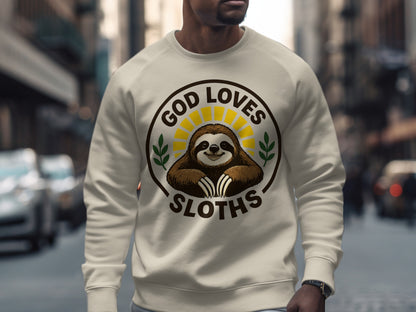 Cream sweatshirt with "God Loves Sloths" circular graphic featuring a smiling sloth.