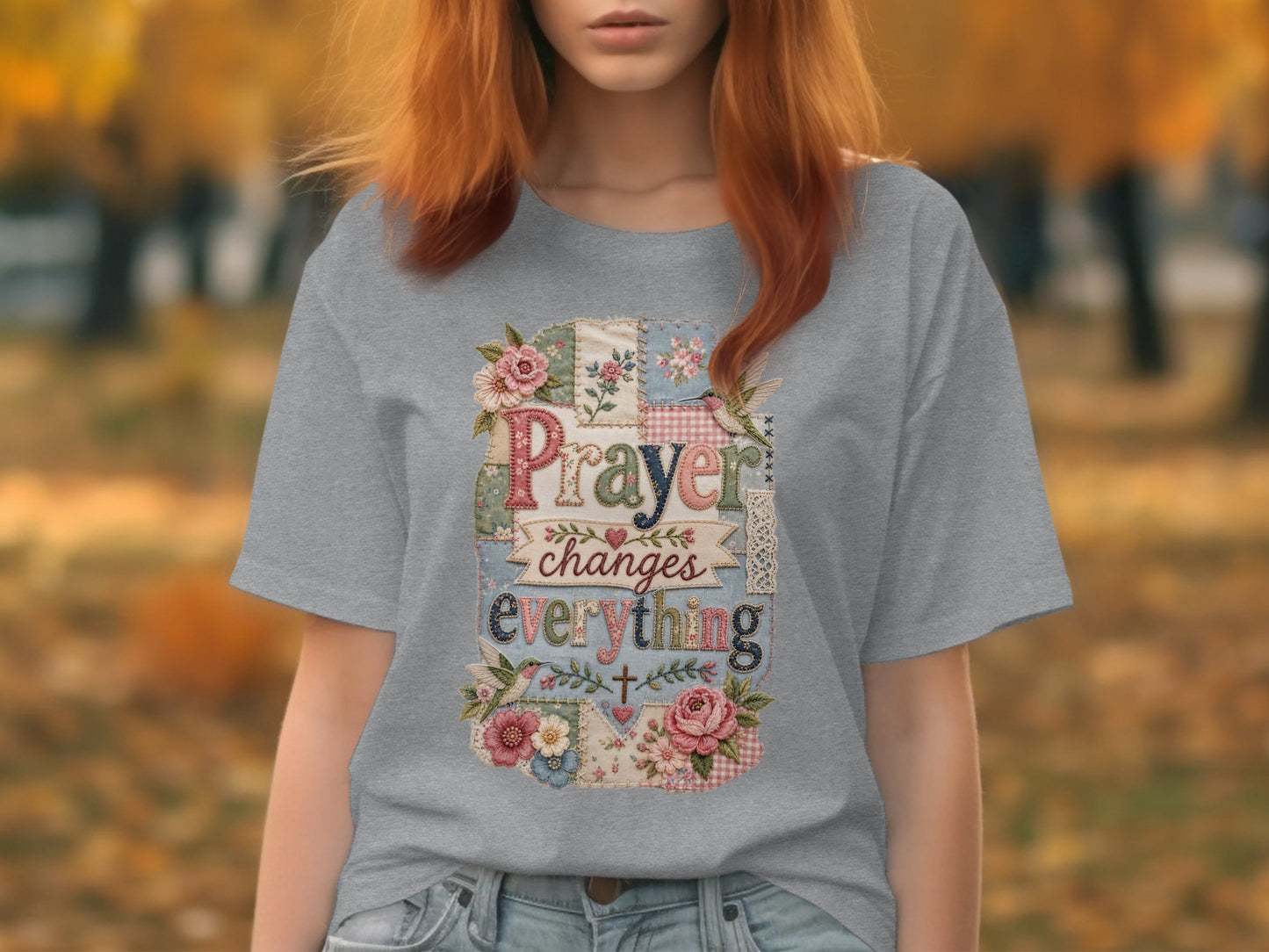 Gray t-shirt with patchwork design and "Prayer changes everything" text.