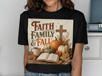 T-shirt with "Faith Family & Fall" graphic featuring pumpkins, a cross, and a bible.