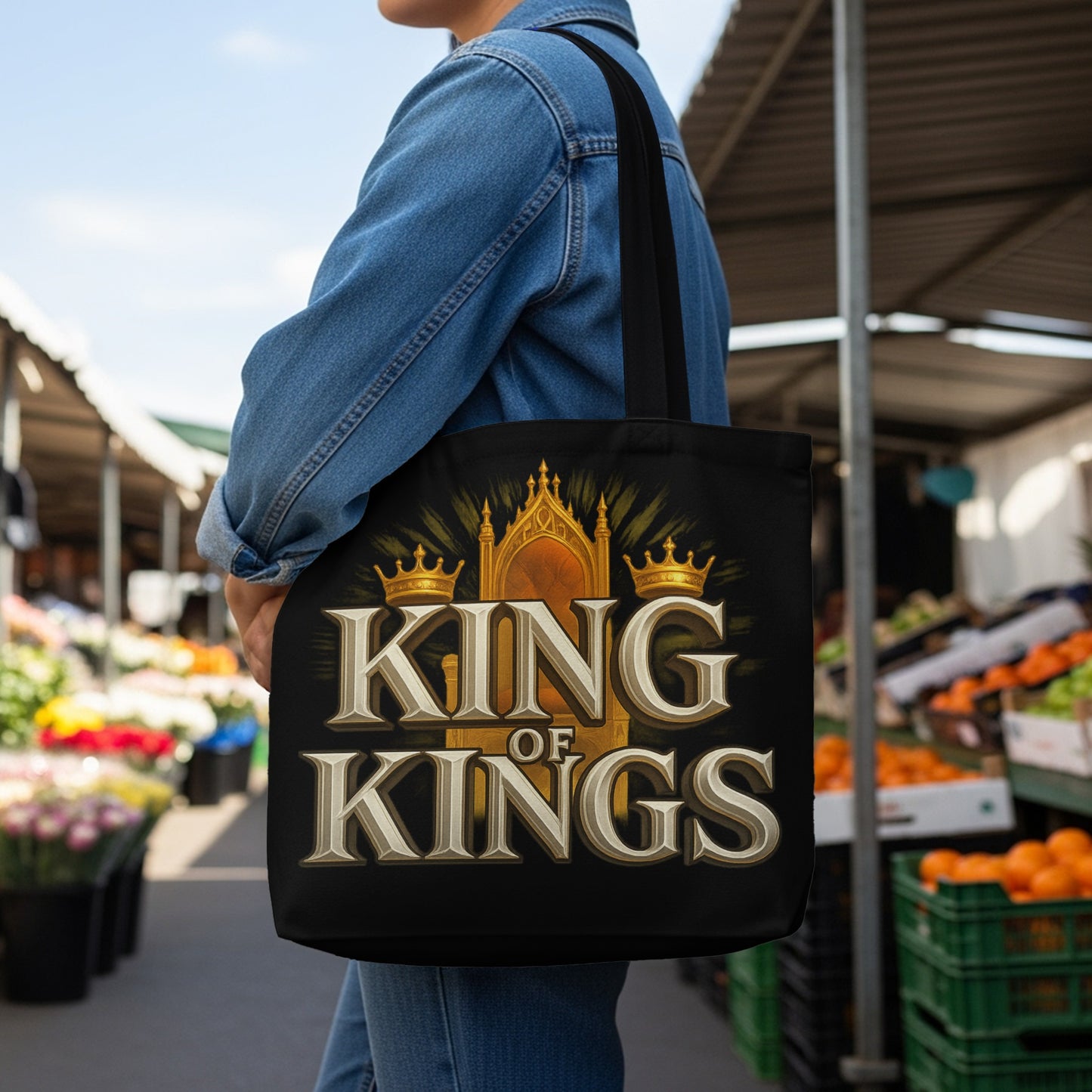 Black tote bag with "KING OF KINGS" text and a crown design.