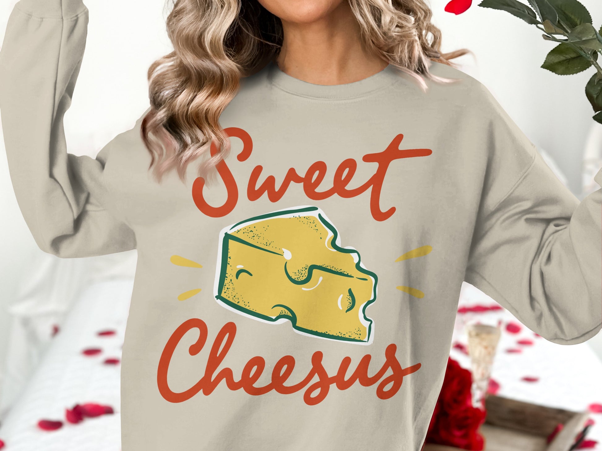 Sweatshirt with "Sweet Cheesus" and cheese graphic.