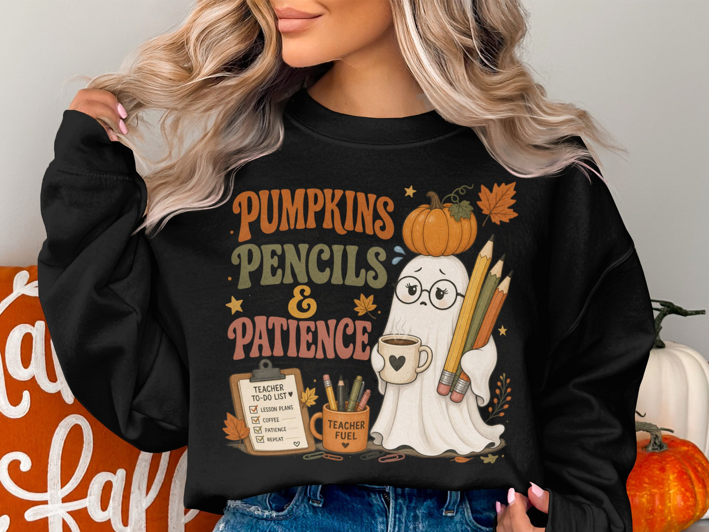 Black sweatshirt with "Pumpkins Pencils & Patience" text and a ghost holding pencils and coffee.
