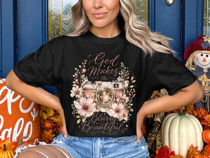 Black t-shirt with vintage camera floral graphic and text "God Makes the Blurry Beautiful."