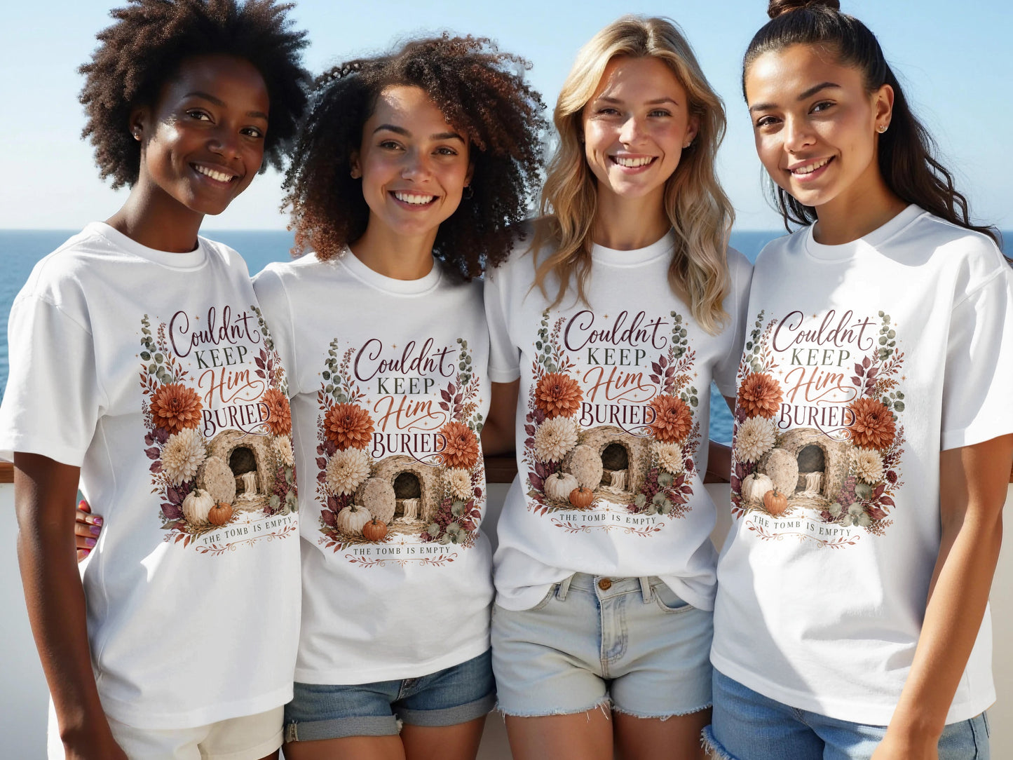 Women wearing white t-shirts with "Couldn't Keep Him Buried" and empty tomb design.