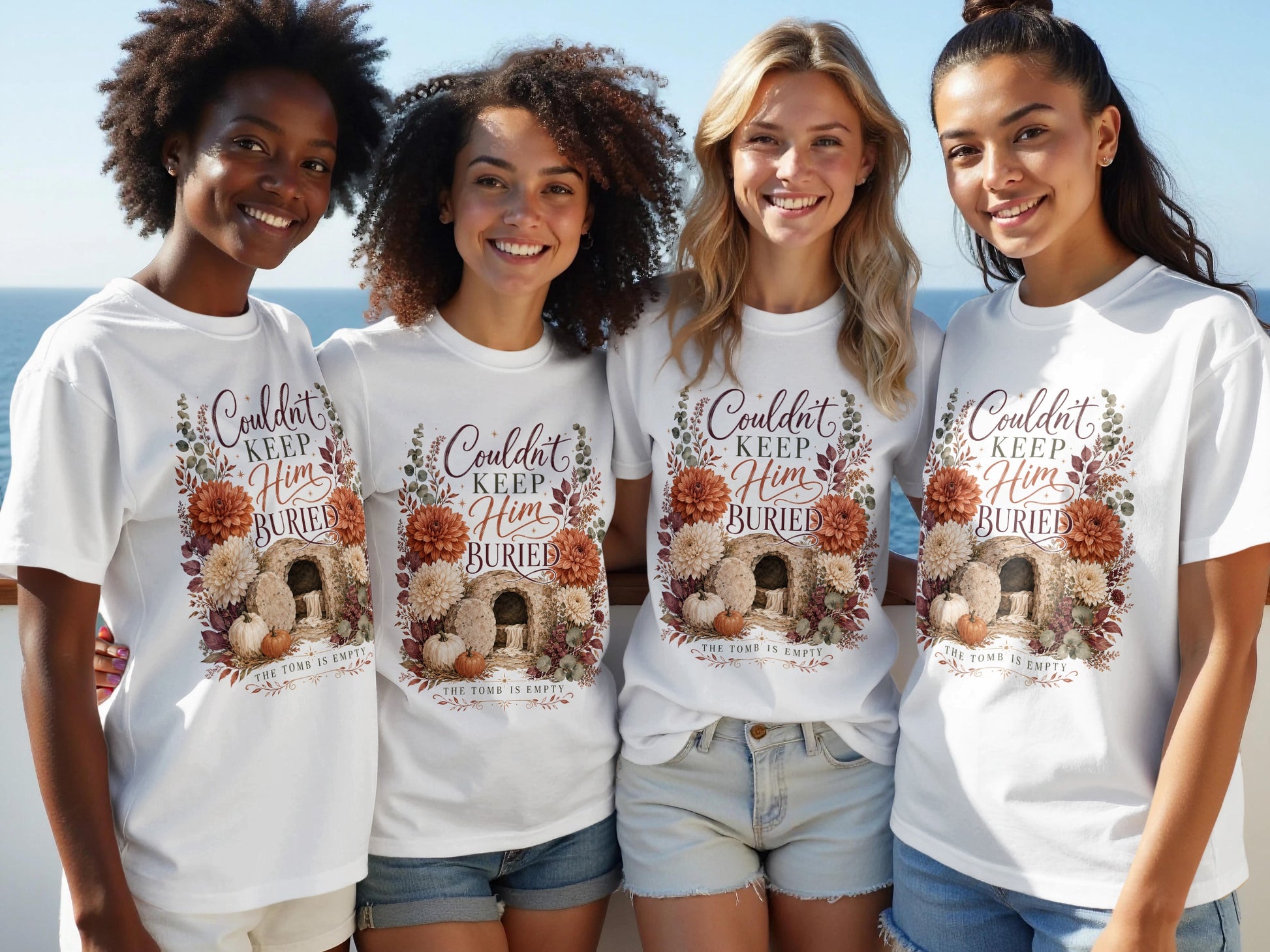 Women wearing white t-shirts with "Couldn't Keep Him Buried" and empty tomb design.