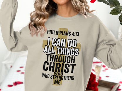Crewneck sweatshirt with "Philippians 4:13" and a gold cross graphic.