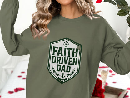 Green crewneck sweatshirt with "FAITH DRIVEN DAD" shield logo.