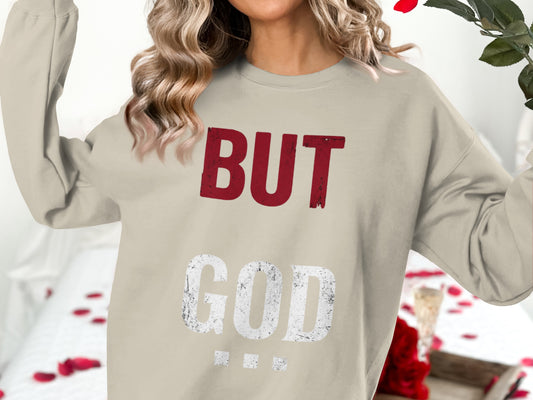 Light beige sweatshirt with "BUT GOD" text in distressed red and white.