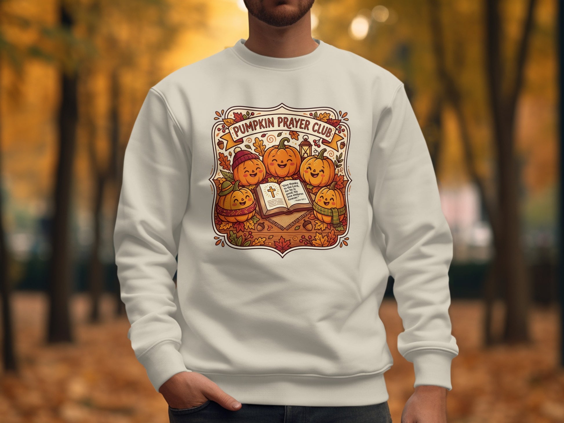 Crewneck sweatshirt with smiling pumpkins and Bible verse Psalm 107:1.