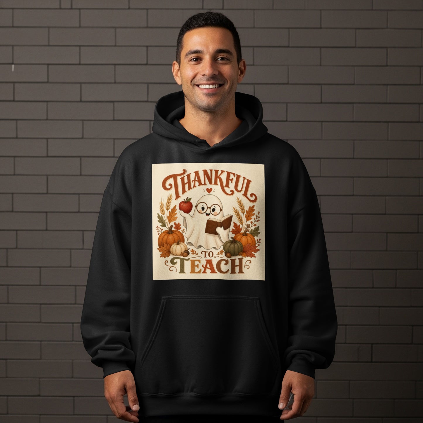 Ghost with apple and book on hoodie, text "Thankful to Teach".