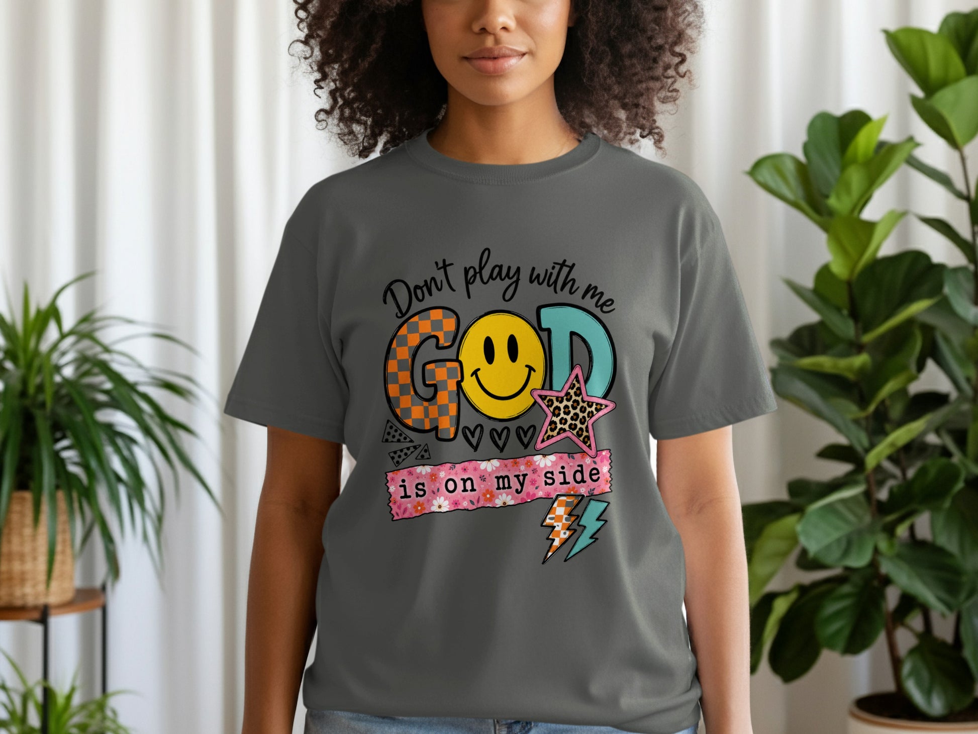 Dark grey t-shirt with "Don't play with me GOD is on my side" graphic.