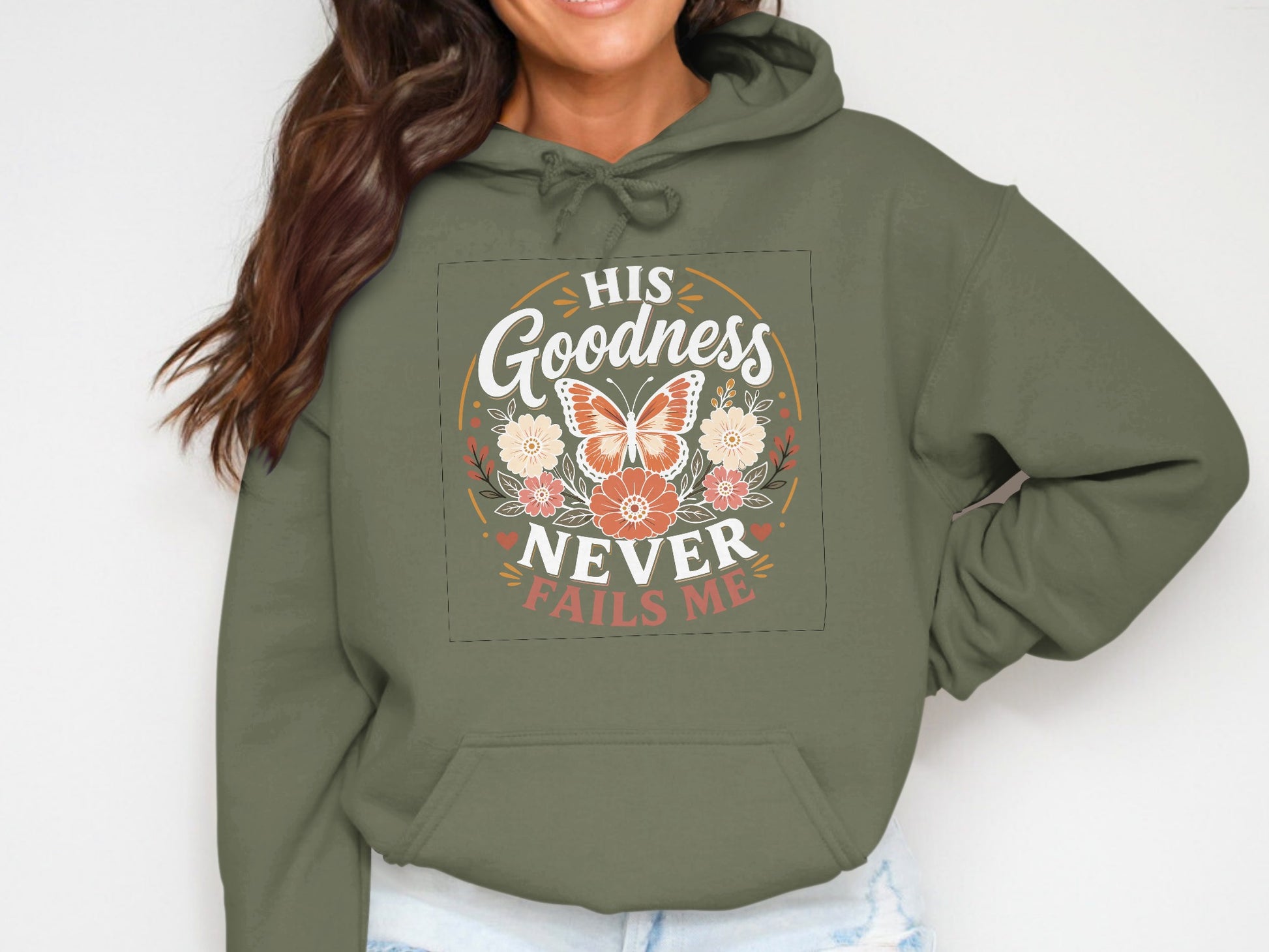 Green hoodie with "His Goodness Never Fails Me" and a butterfly design.