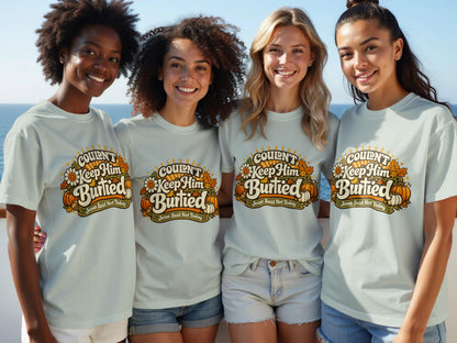 Four women in light blue t-shirts with "Couldn't Keep Him Buried" text.