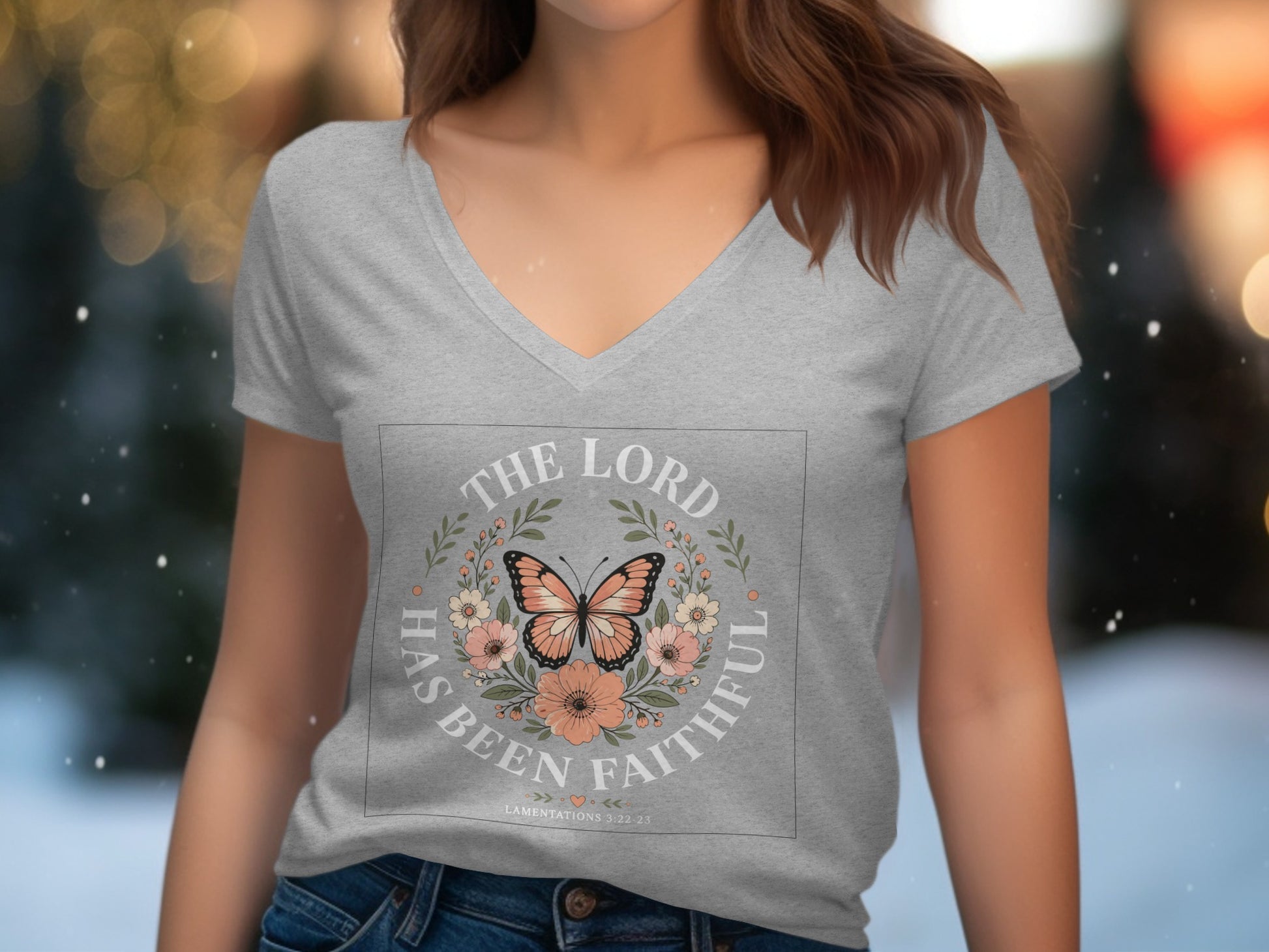 Gray v-neck t-shirt with "The Lord Has Been Faithful" and floral butterfly design.