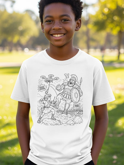 Boy wearing a t-shirt with a cartoon illustration of David facing Goliath.