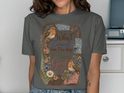 Gray t-shirt with floral border, two birds, and the text "When I Cannot See The Way I Trust God".