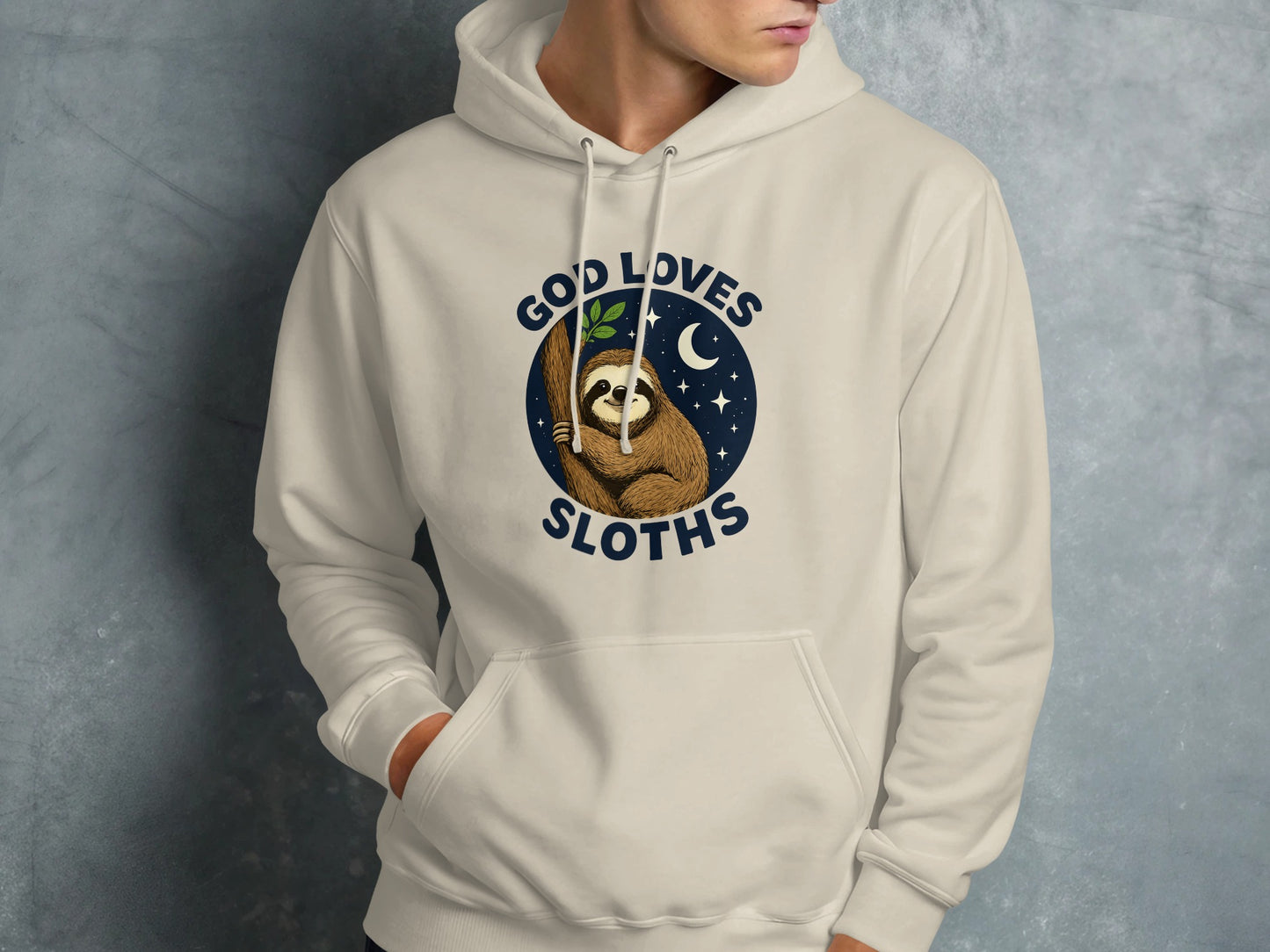 Cream hoodie with a sloth illustration and the text "God Loves Sloths".