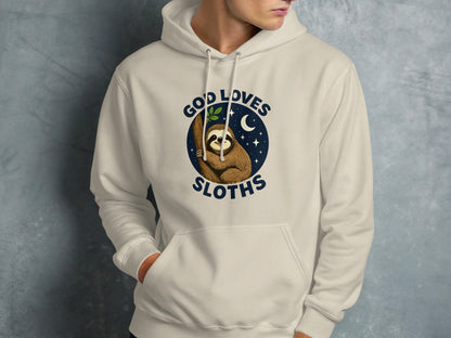 Cream hoodie with a sloth illustration and the text "God Loves Sloths".