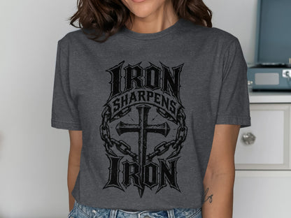 Dark grey t-shirt with "Iron Sharpens Iron" text and cross graphic.