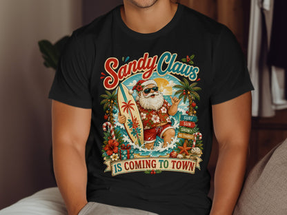 Santa Claus on a surfboard with "Sandy Claws is Coming to Town" text.