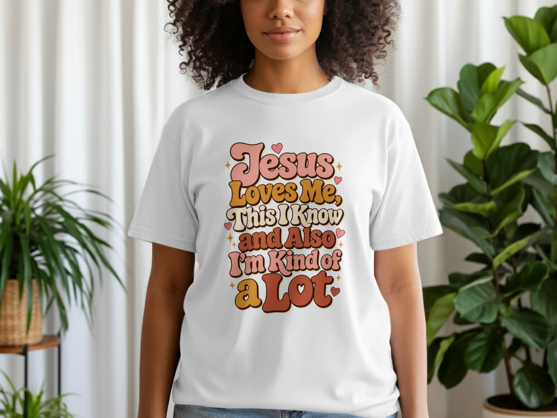 White t-shirt with "Jesus Loves Me, This I Know and Also I'm Kind of a Lot" text.