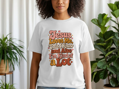 White t-shirt with "Jesus Loves Me, This I Know and Also I'm Kind of a Lot" text.