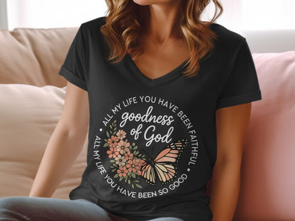 Black v-neck t-shirt with "goodness of God" and butterfly graphic.