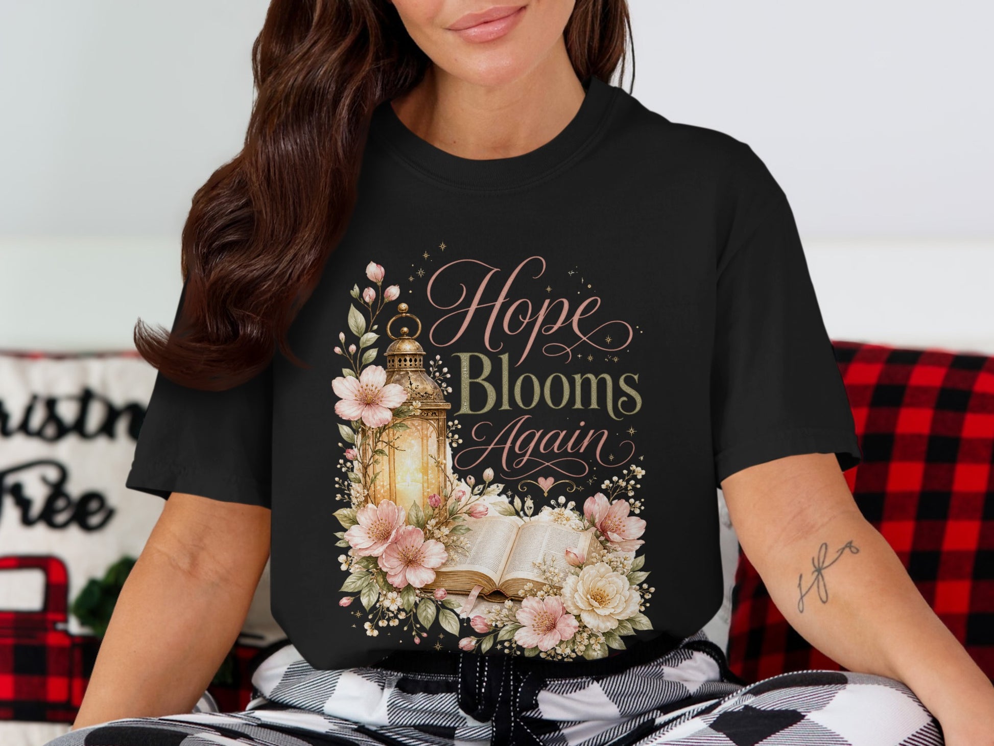 Black t-shirt with "Hope Blooms Again" text, lantern, and floral design.