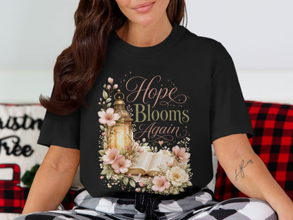 Black t-shirt with "Hope Blooms Again" text, lantern, and floral design.