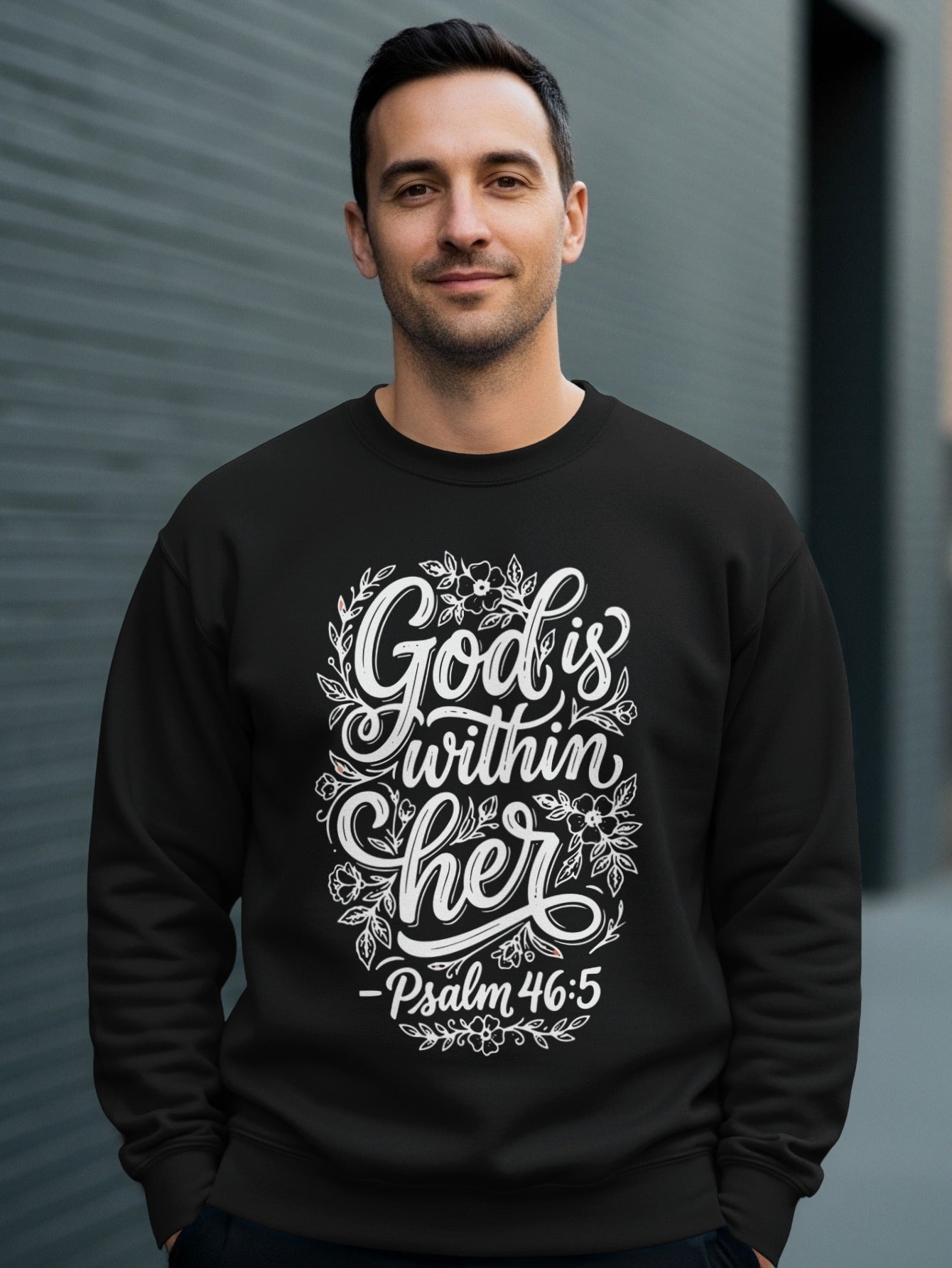 Black sweatshirt with "God is within her" floral design and Psalm 46:5.