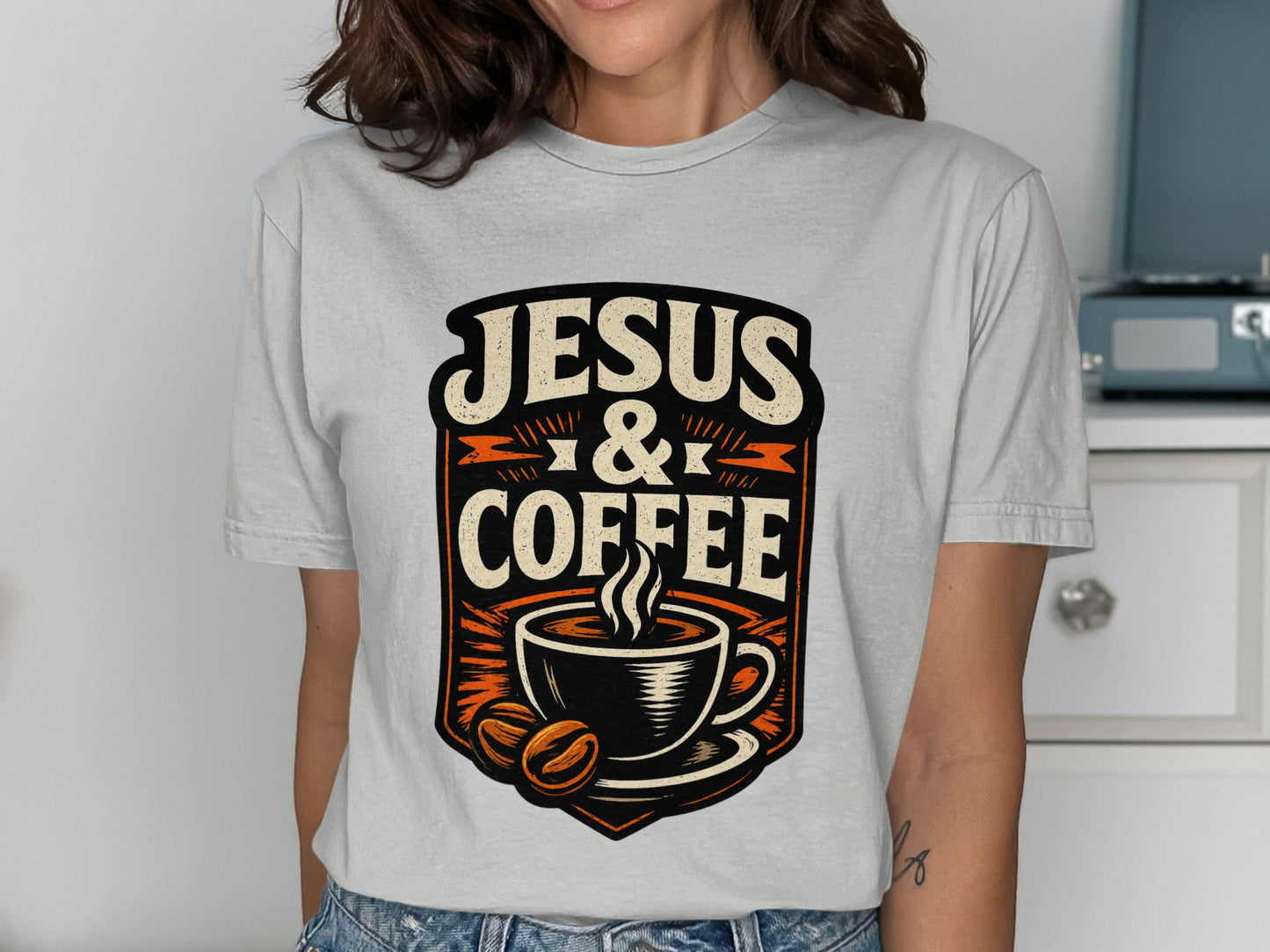 Jesus & Coffee graphic with steaming mug and coffee beans on a t-shirt.