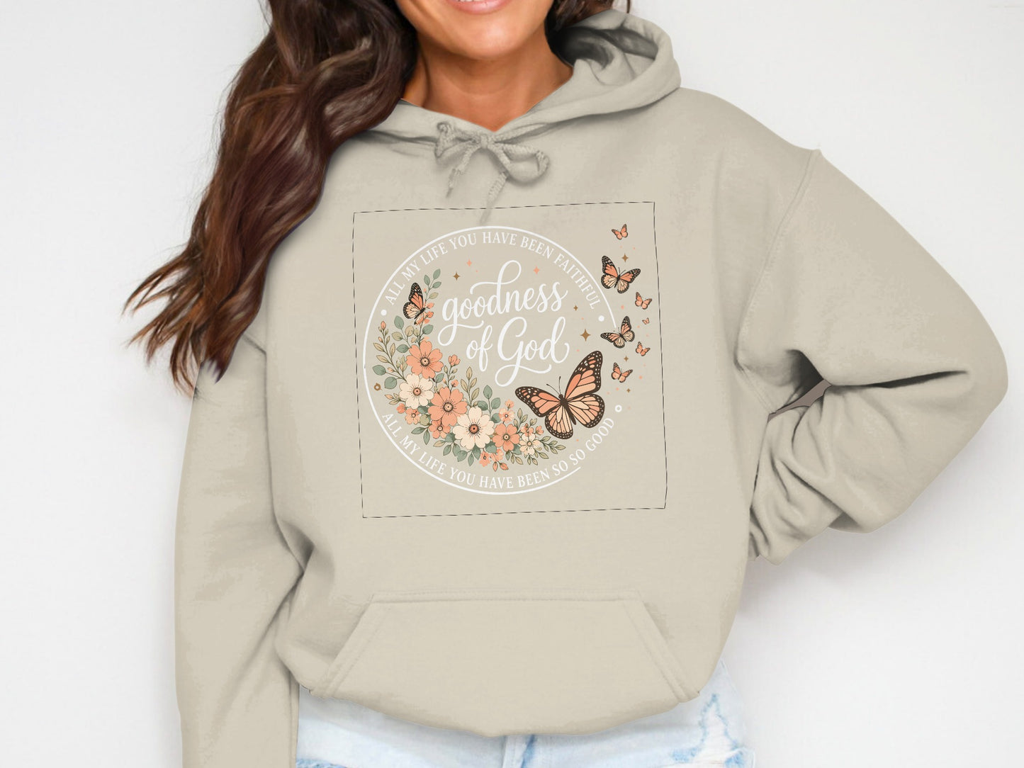 Beige hoodie with floral and butterfly graphic and "Goodness of God" text.