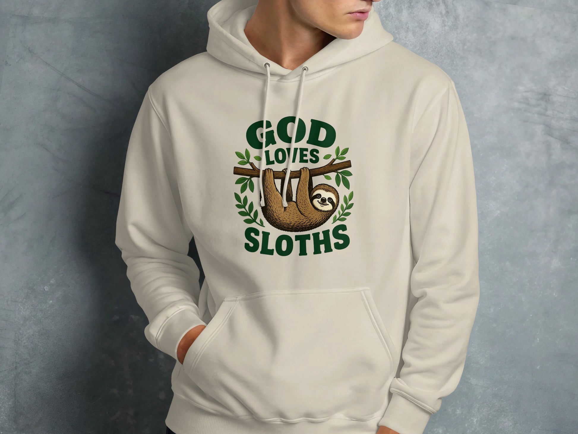 Cream hoodie with "God Loves Sloths" text and a sloth hanging from a branch.