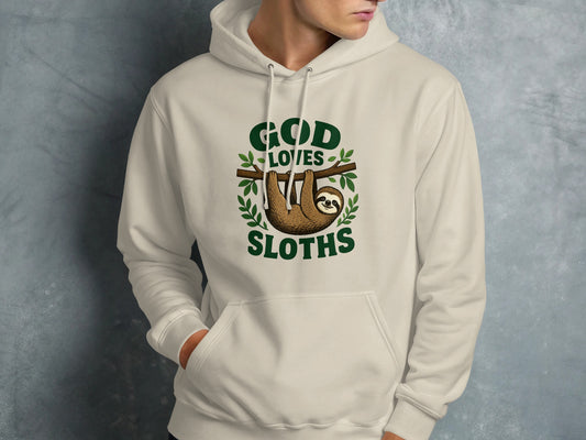 Cream hoodie with "God Loves Sloths" text and a sloth hanging from a branch.