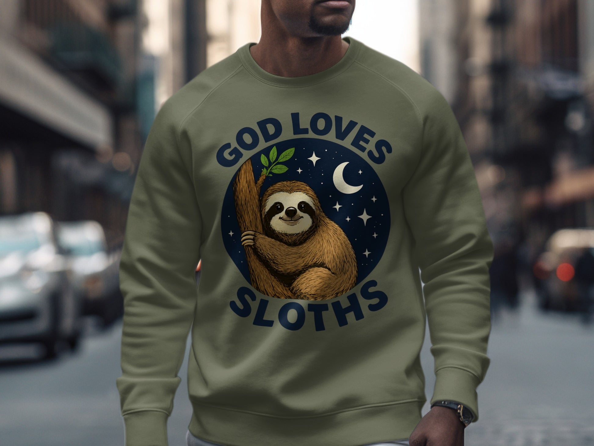 Olive sweatshirt with a circular graphic of a sloth on a branch, with "God Loves Sloths" text.