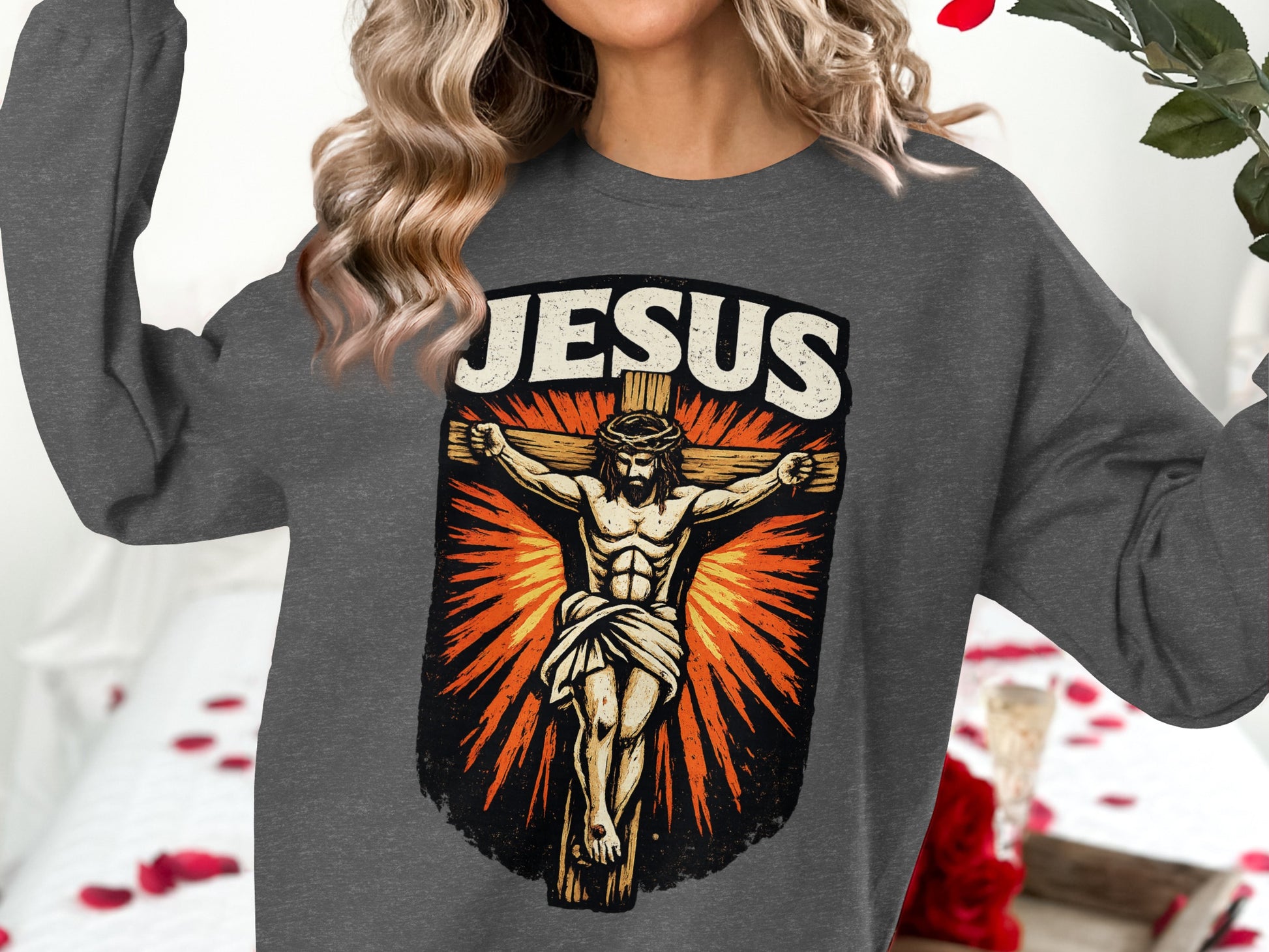 Jesus Christ on the cross graphic on a dark gray crewneck sweatshirt.