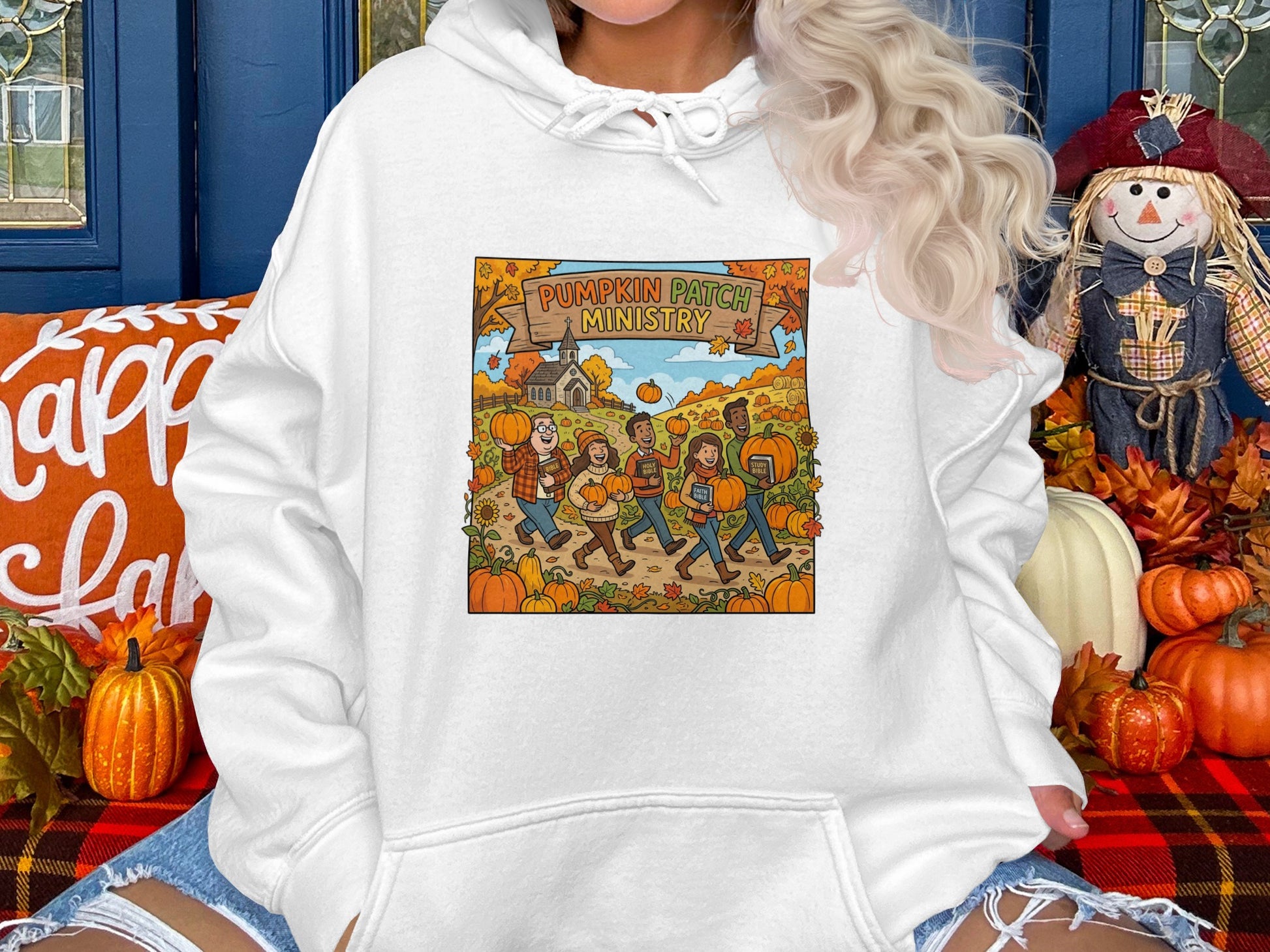 Hoodie with "Pumpkin Patch Ministry" cartoon of people carrying pumpkins.