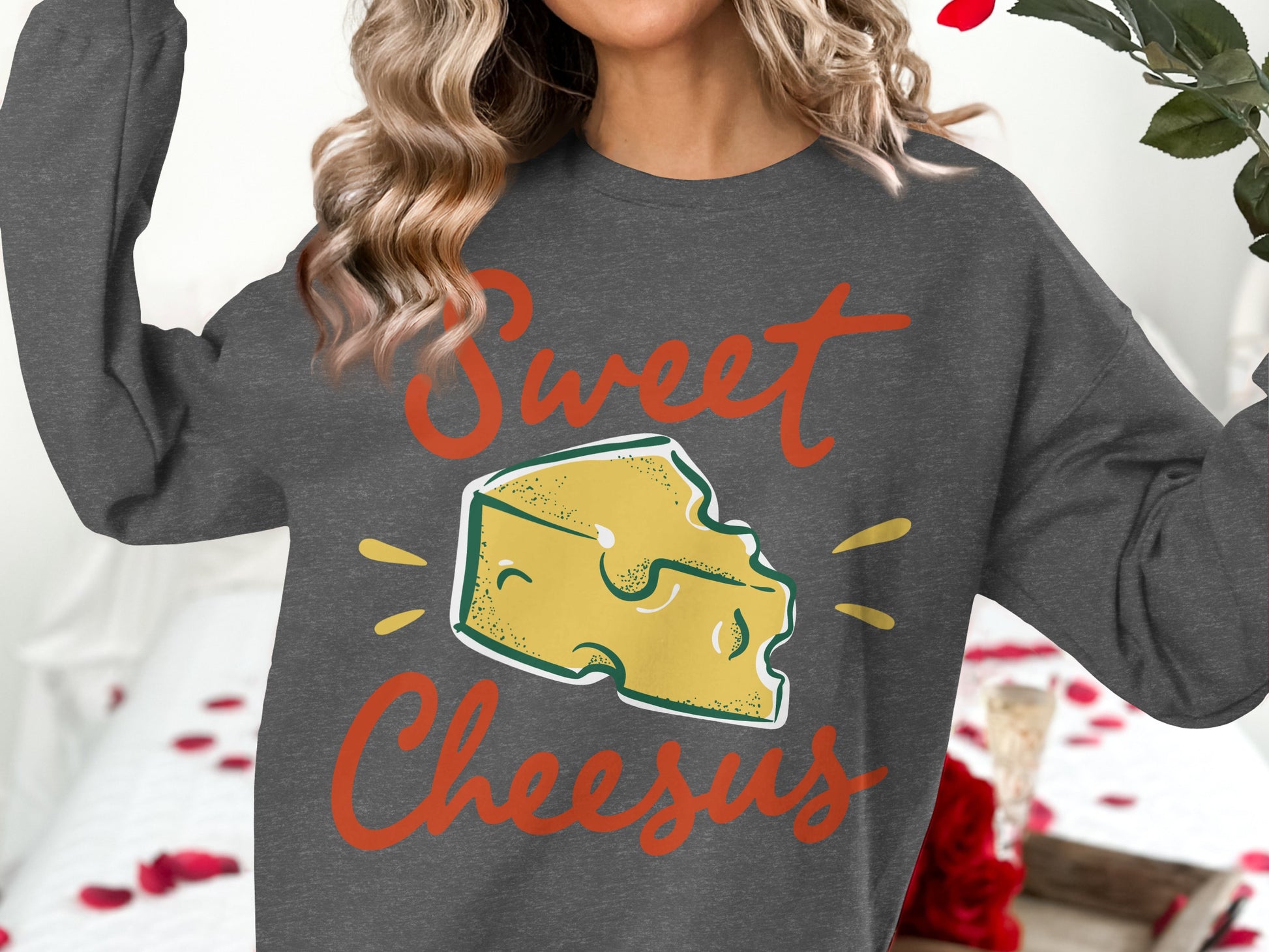 Dark grey sweatshirt with "Sweet Cheesus" text and cheese graphic.