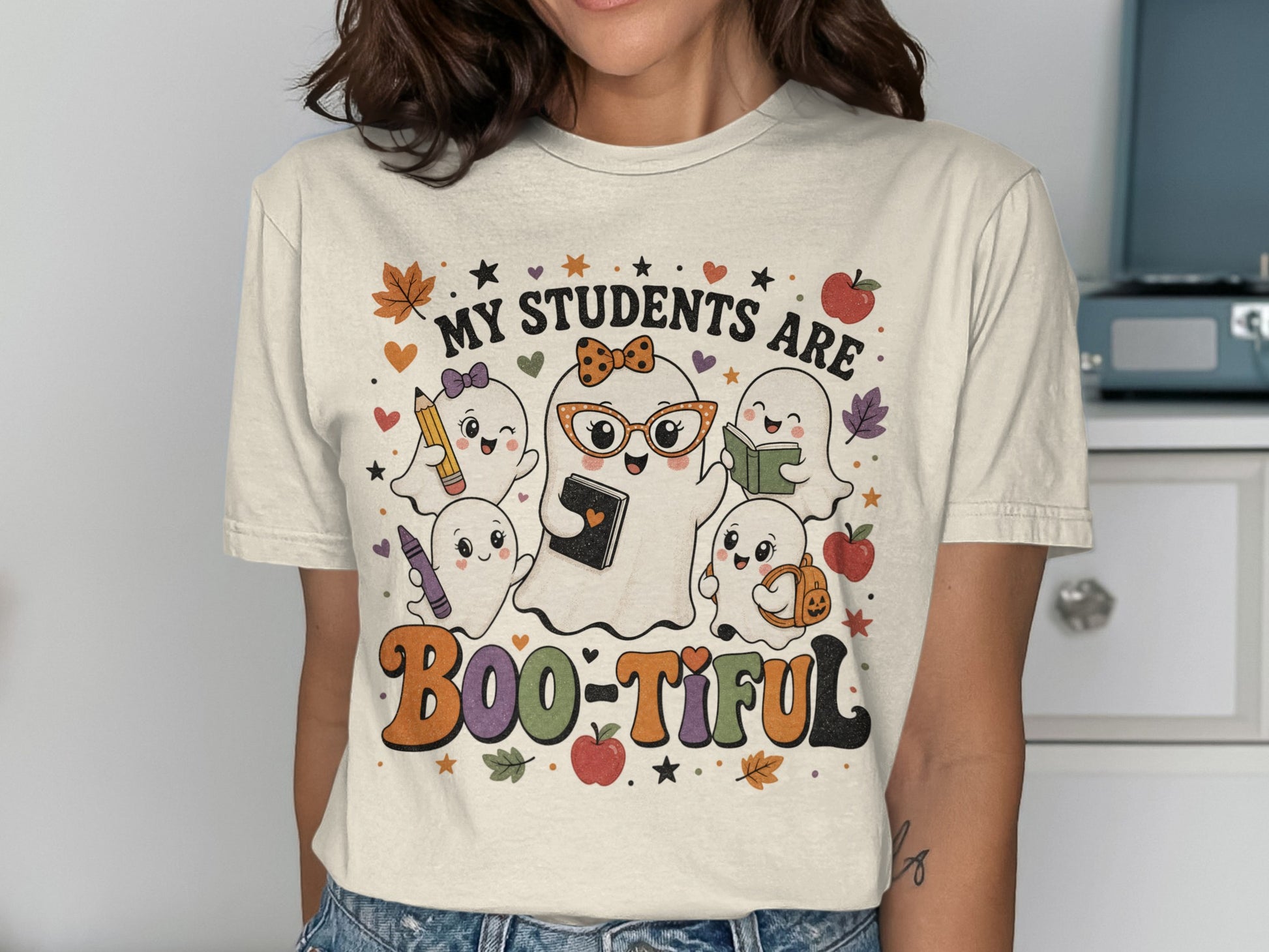 "My Students Are Boo-tiful" text with cute ghosts holding school supplies.