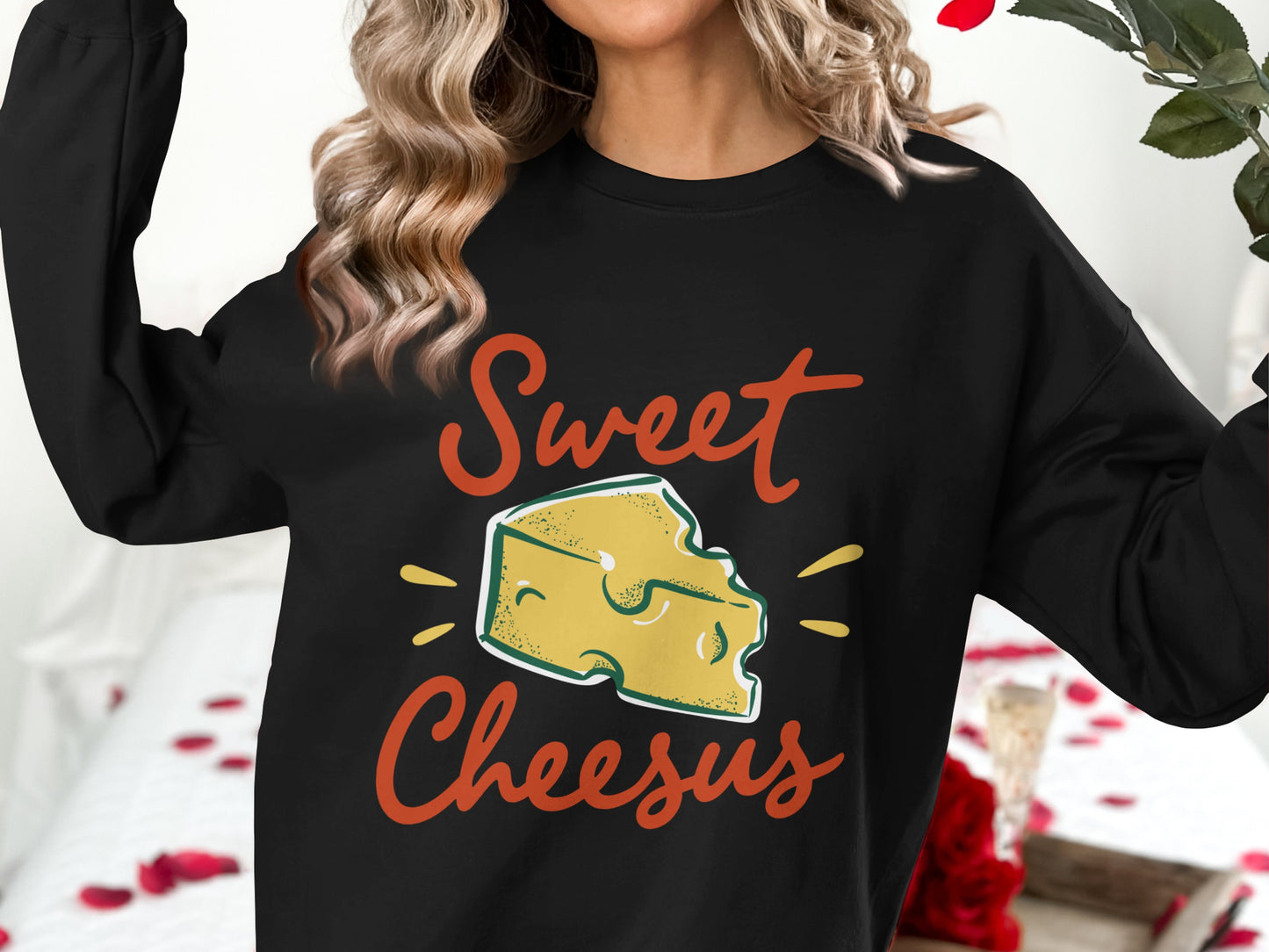 Black sweatshirt with "Sweet Cheesus" text and cheese graphic.